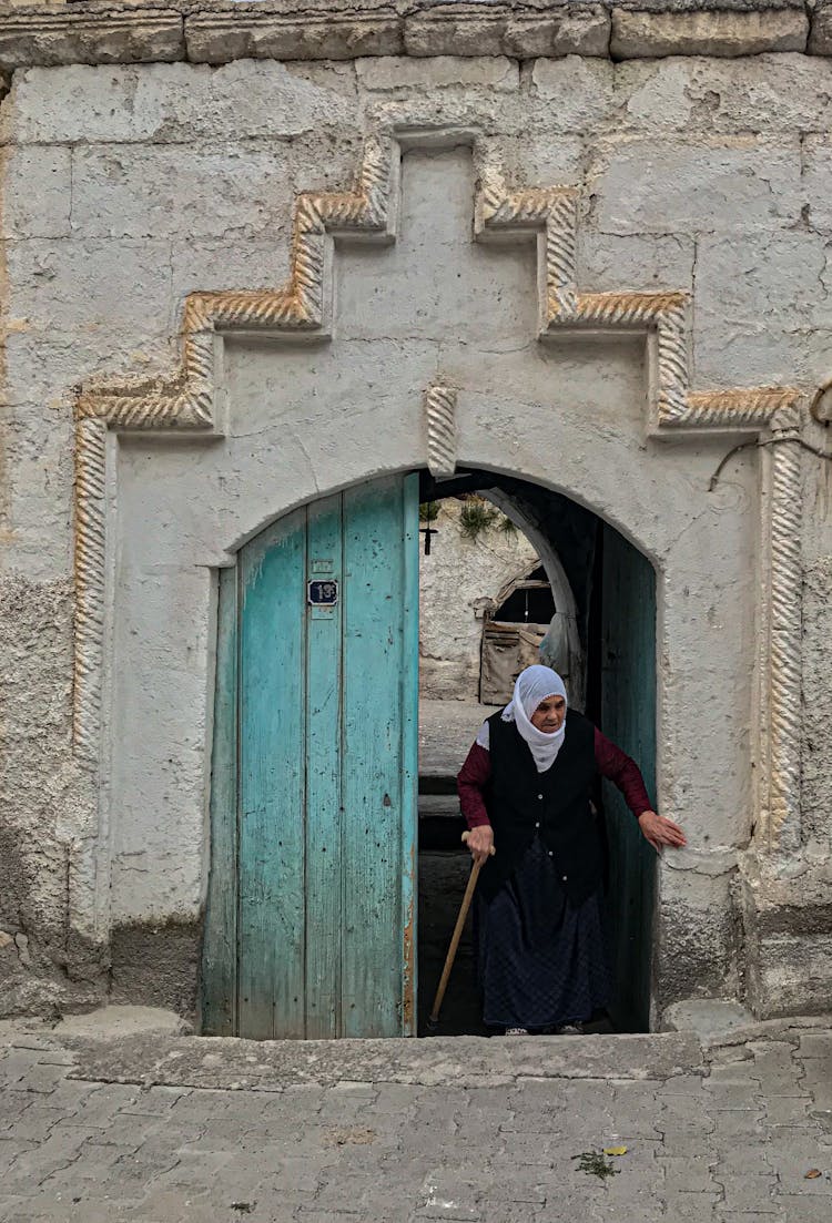 Woman Walking From Building