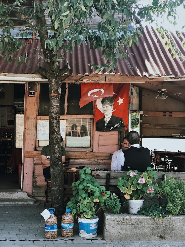 People Sitting In Outdoors Cafe 