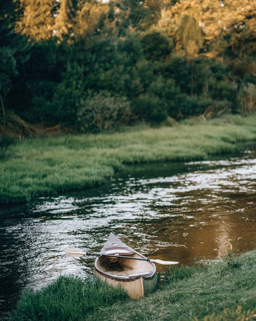 Free Canoe on the River Bank Stock Photo