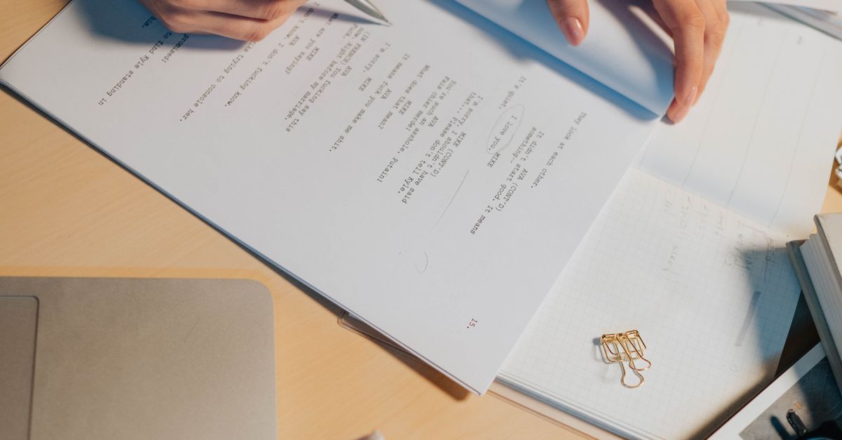 Woman Hands Holding Papers and Writing · Free Stock Photo