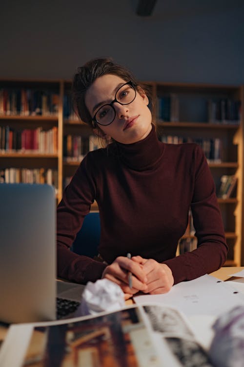 Woman in Long Sleeve Shirt Wearing Black Framed Eyeglasses