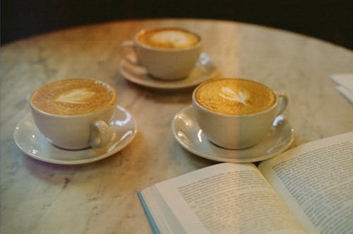 Free Coffee Cups near Book in Turkish Stock Photo