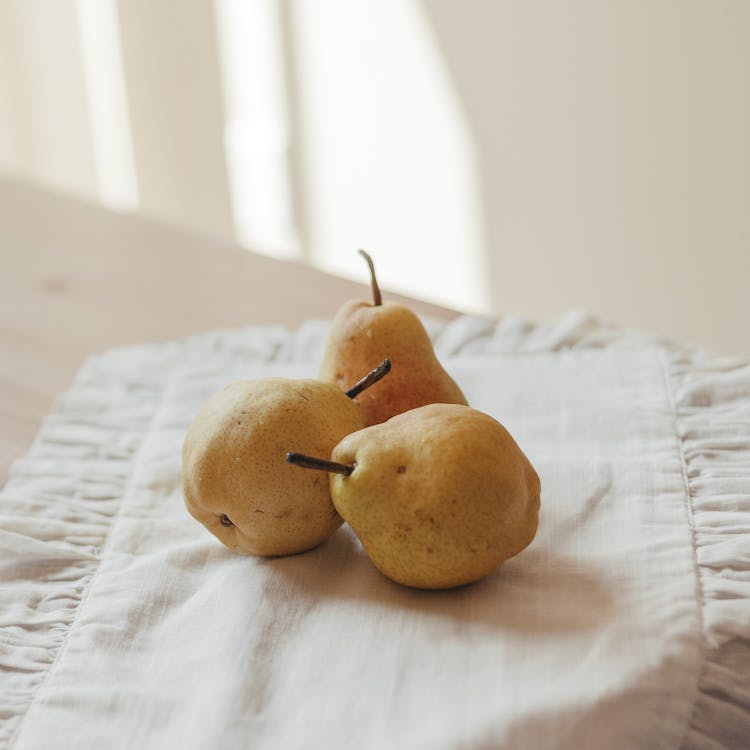 Fresh Pears Over A Cloth On A Table