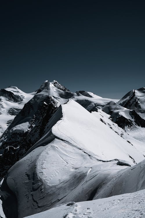 Snow-Covered Mountains under the Sky