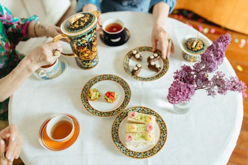 Cakes and Tea Served on a Table