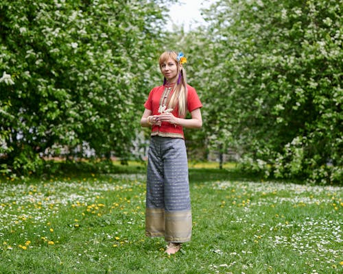 Woman Standing on Grass Field 