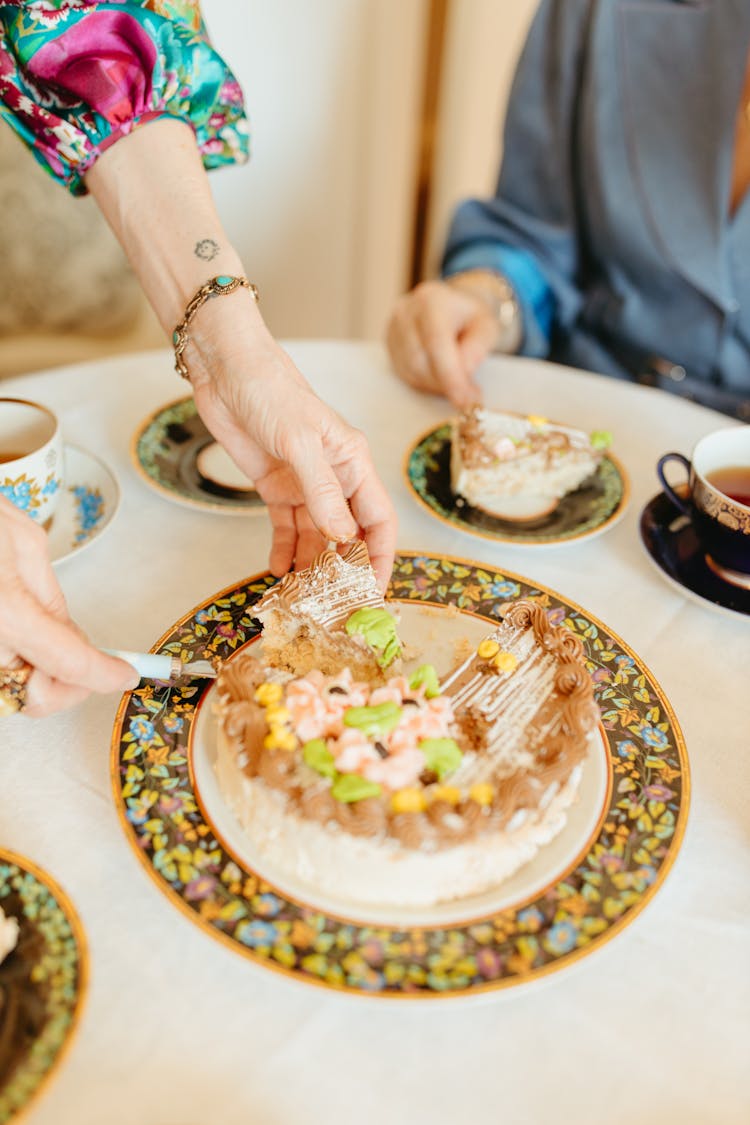 Person Getting Slice Of Cake 