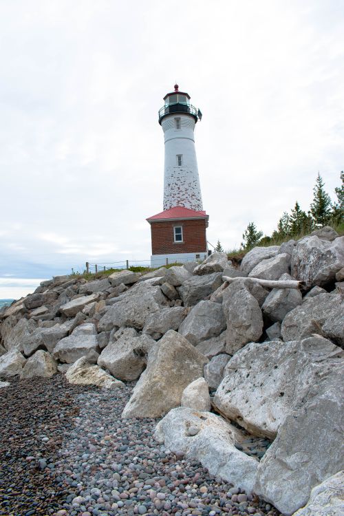 Lighthouse By Rocks Rocks near Lighthouse · Free Stock Photo