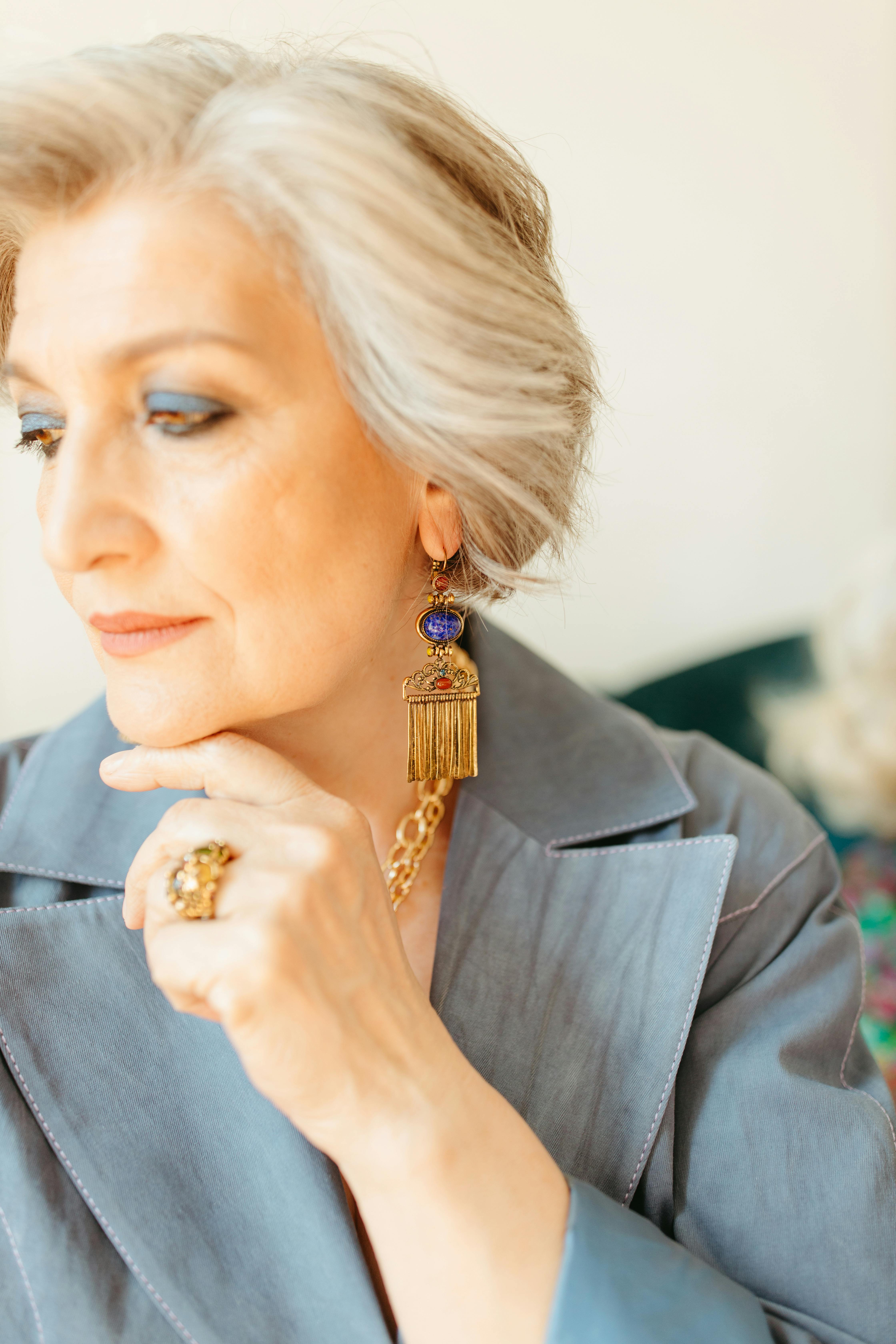 woman wearing gold jewelries