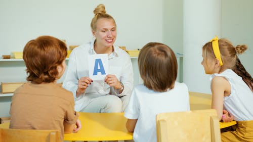 Free A Woman Teaching a Children Stock Photo