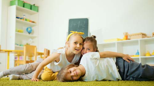 Kids at the Classroom Playing on  Textured Carpet 