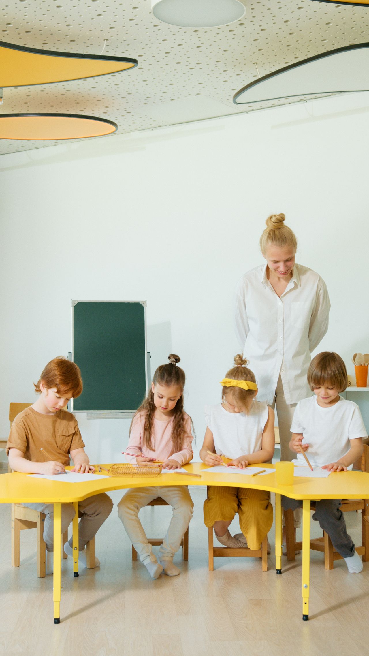 A healthcare worker leading a session with several children
