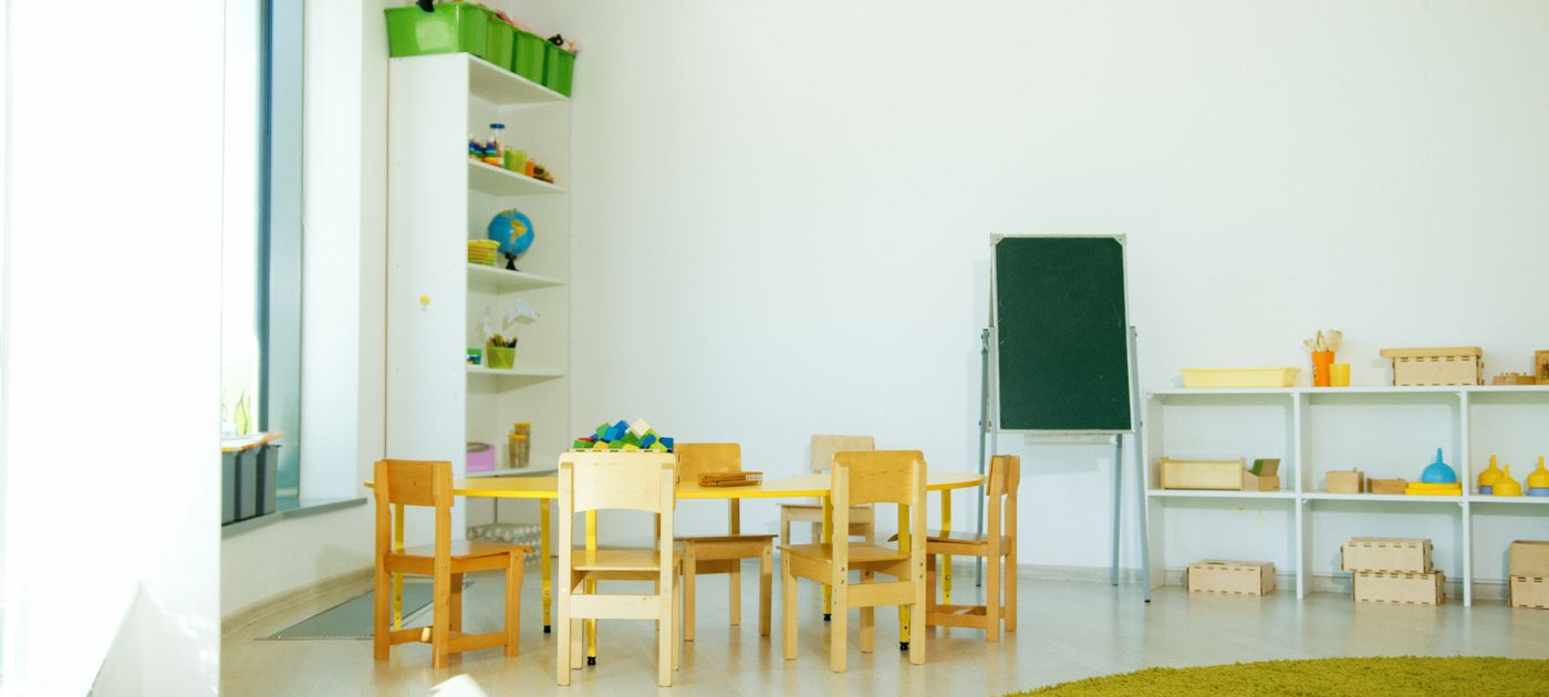 A bright, colourful kindergarten classroom — pest control here has to be child-safe and non-toxic