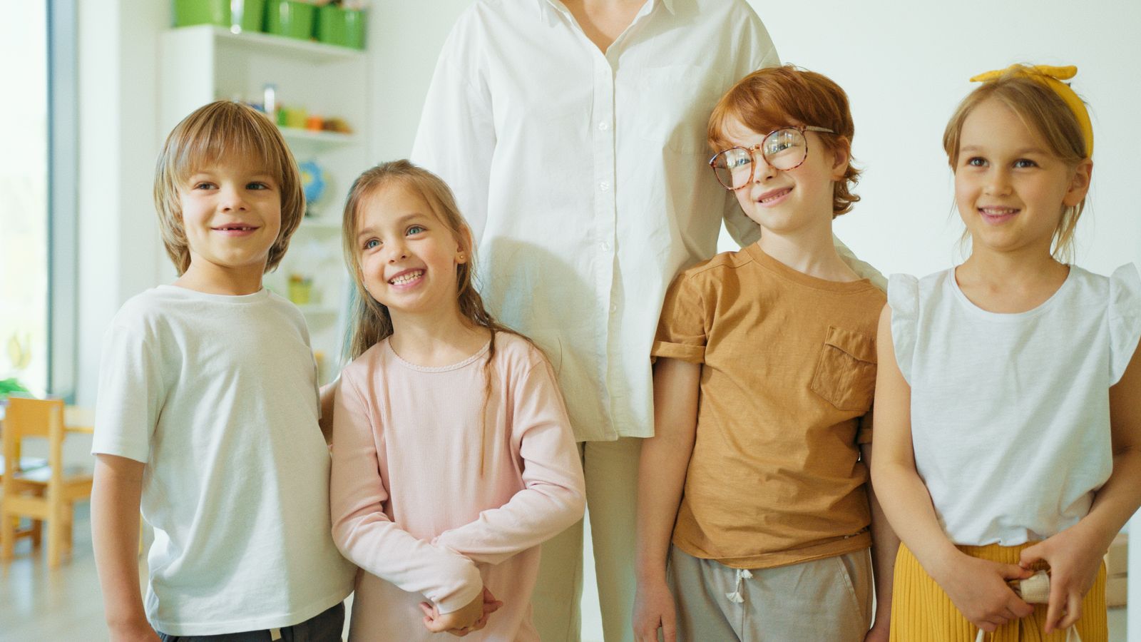Joyful group of smiling children together indoors