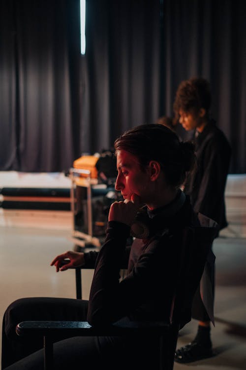 Side View of Person Sitting on Armchair 