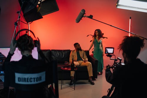 A Behind the Scene Picture of a Man Sitting on Couch Beside a Woman
