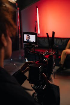 Behind the scenes of a film production with camera crew working on set.