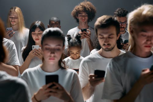 Free Photo of People Engaged on their Phones Stock Photo
