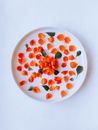 Composition of red petals on plate