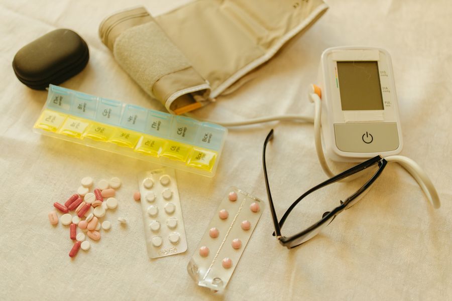 Blood pressure monitor, medication organizer, and home health essentials