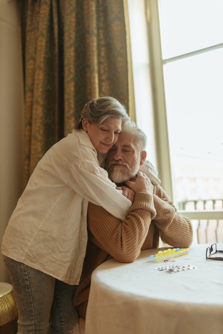 Elderly Couple Hugging Each Other