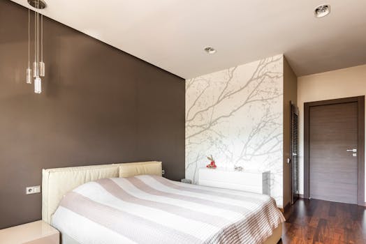 Contemporary bedroom featuring modern minimalist design with neutral tones.