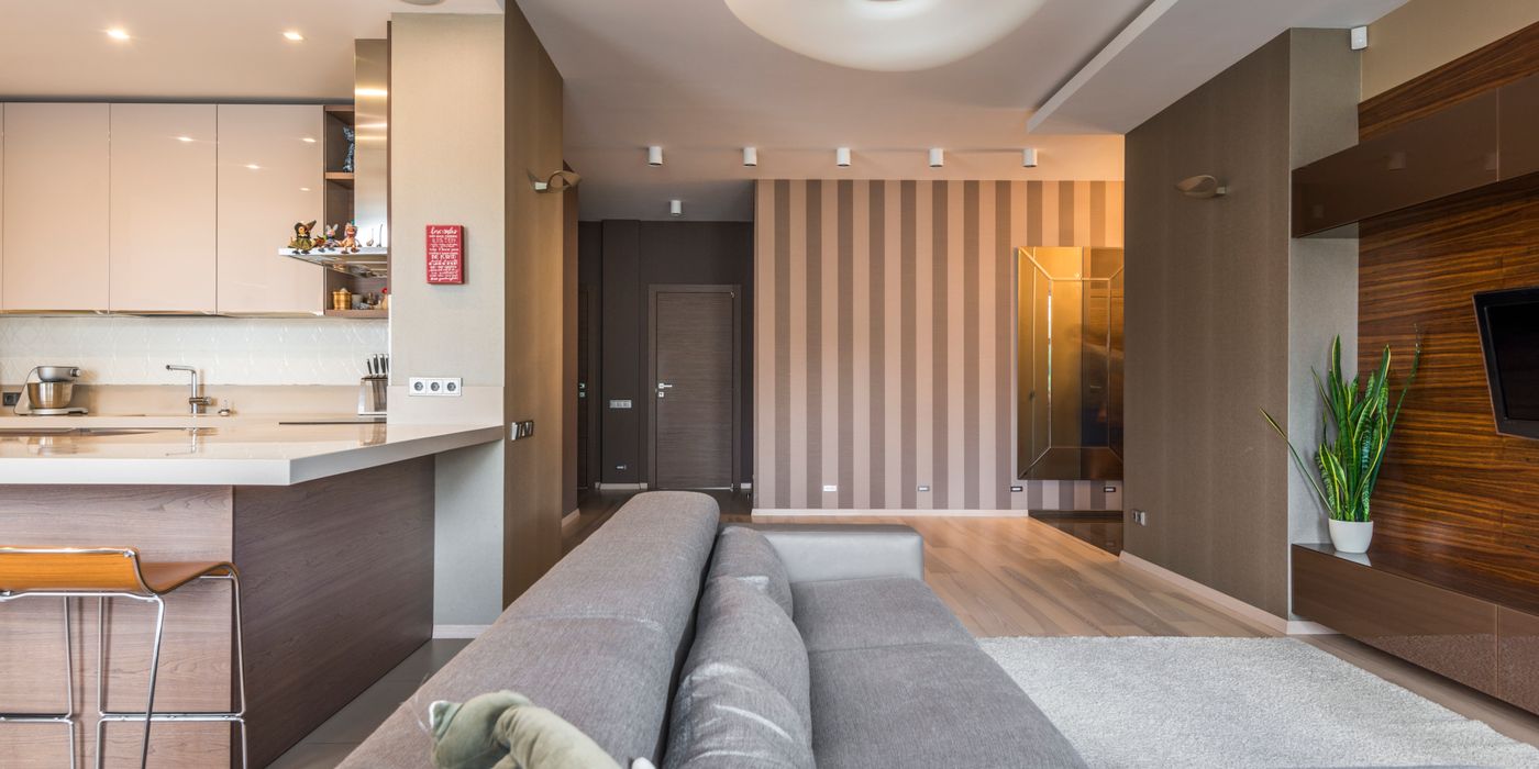 Serviced apartment living room with an open kitchen and dining table