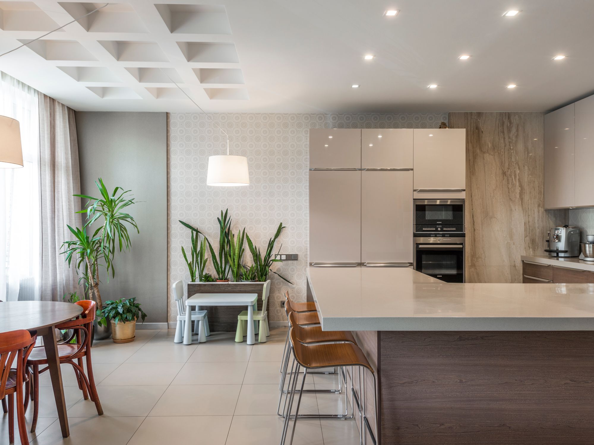 Wallpapering in Herne Hill, Lambeth — decorator hanging pattern-matched wallpaper