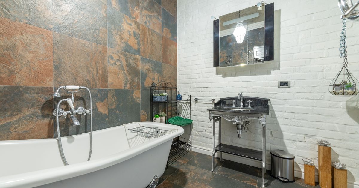 Explore a beautifully styled bathroom featuring a clawfoot tub and modern design elements.