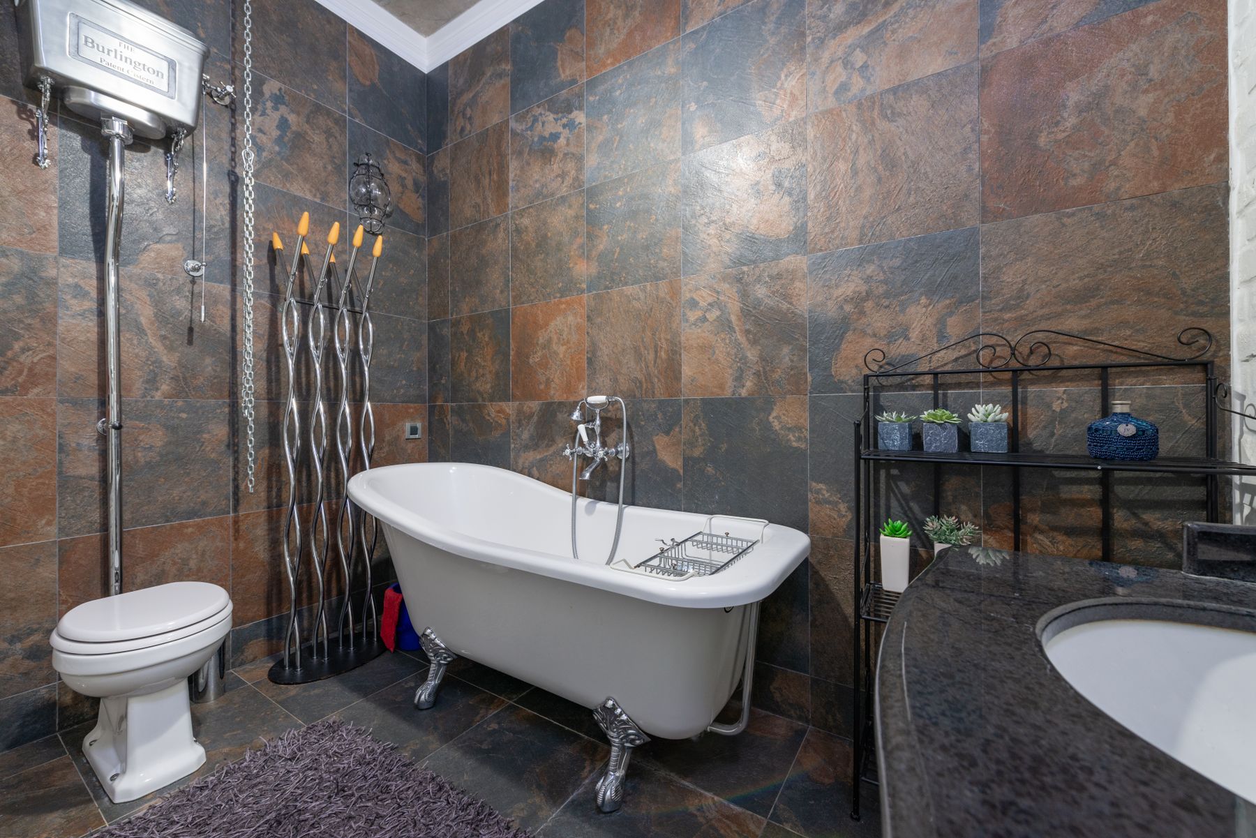 Classic bathroom with clawfoot bathtub and refined neutral finishes