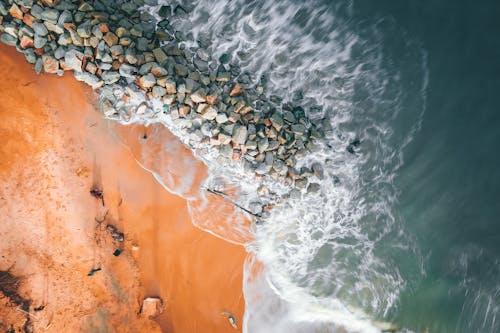 Aerial Shot of Rocks in the Seashore 