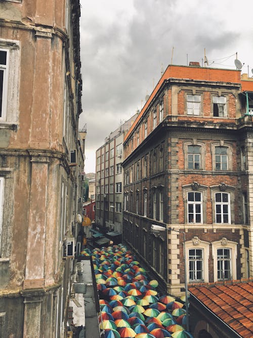 Umbrellas between Tenement Houses in Old Town