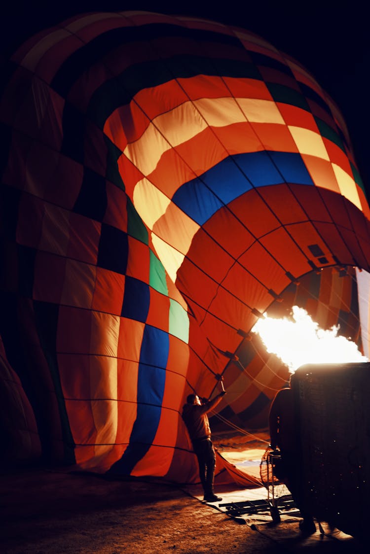 Man Standing Near The Broken Hot Air Balloon