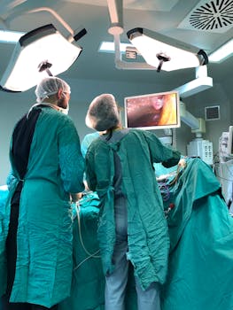 Two surgeons work meticulously in a bright and equipped operating room.