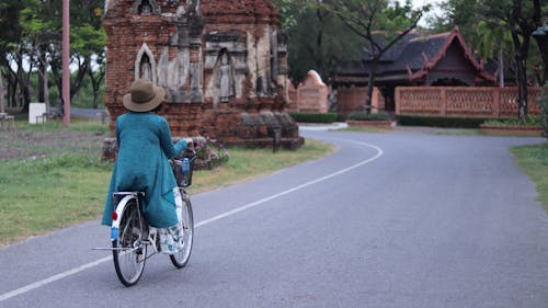 Back View of Person Riding a Bicycle