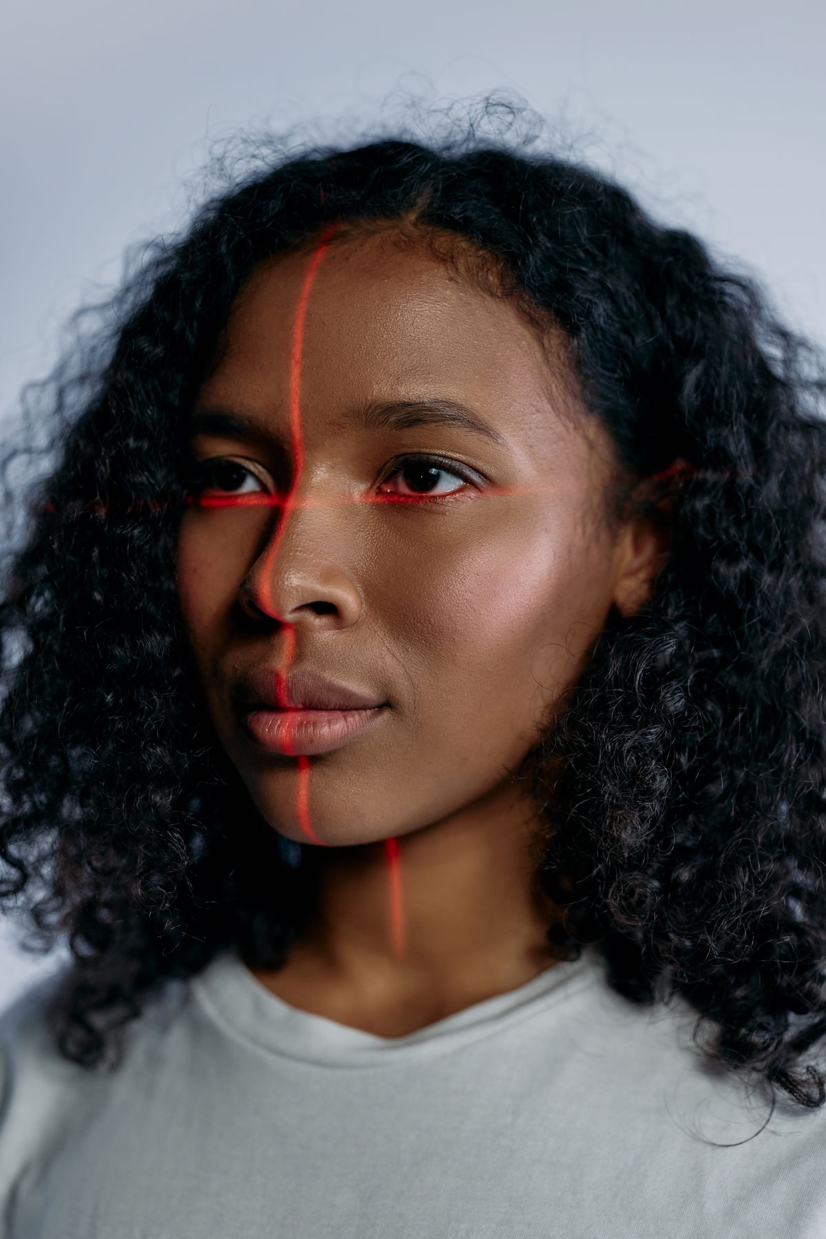 Face being verified by a biometric scanning light