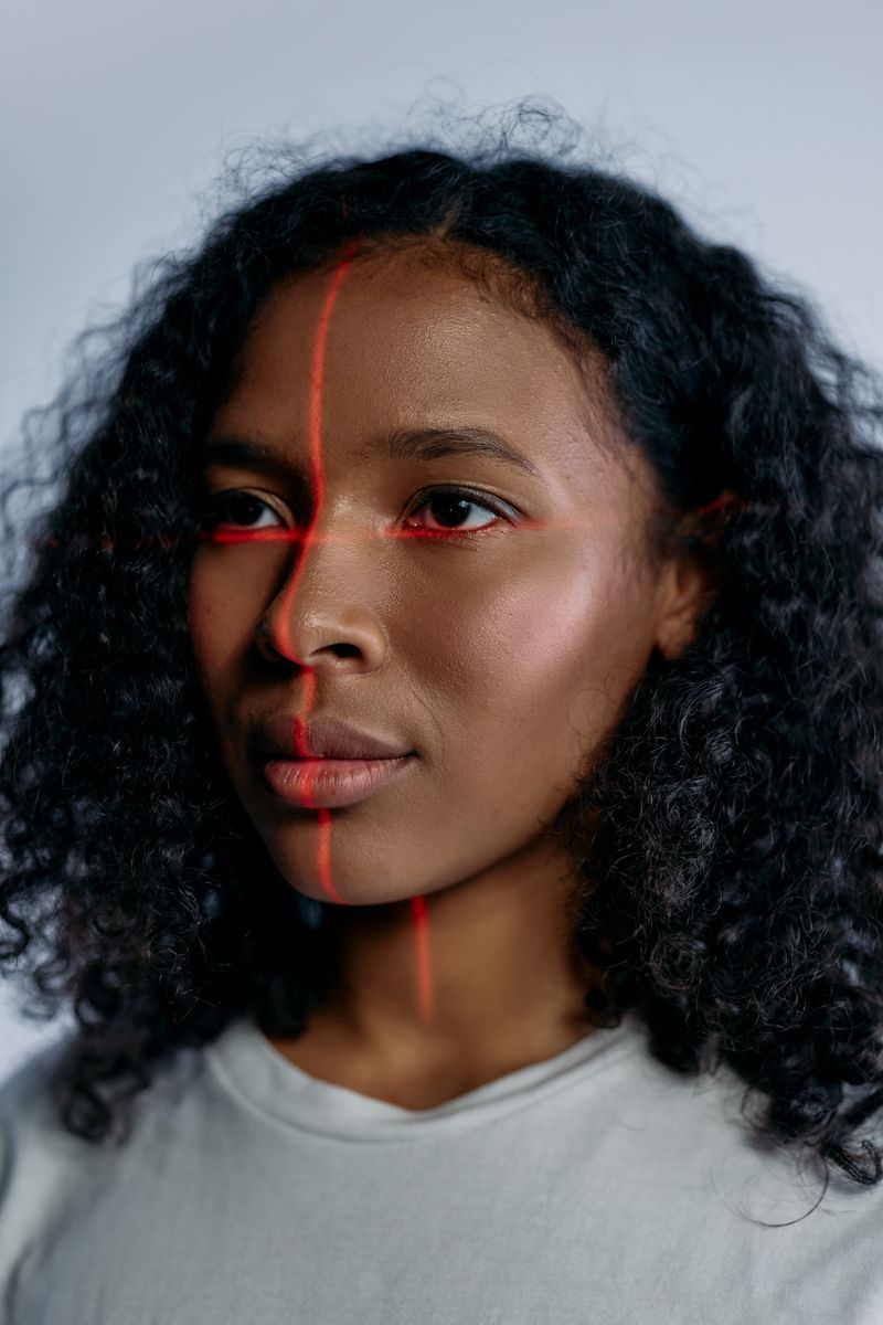 Face being verified by a biometric scanning light