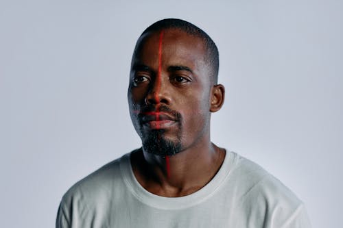 Portrait Photo of Man in White Crew Neck Shirt