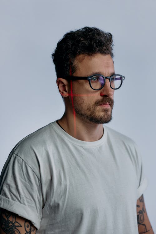 Photo of Man Wearing Black Framed Glasses