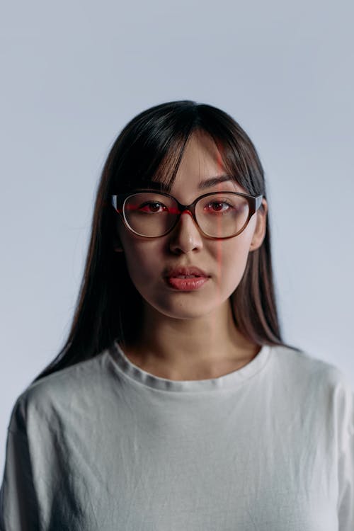 Portrait Photo of Woman in White Crew Neck Shirt