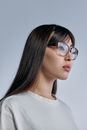 Photo of Woman in Brown Frame Glasses
