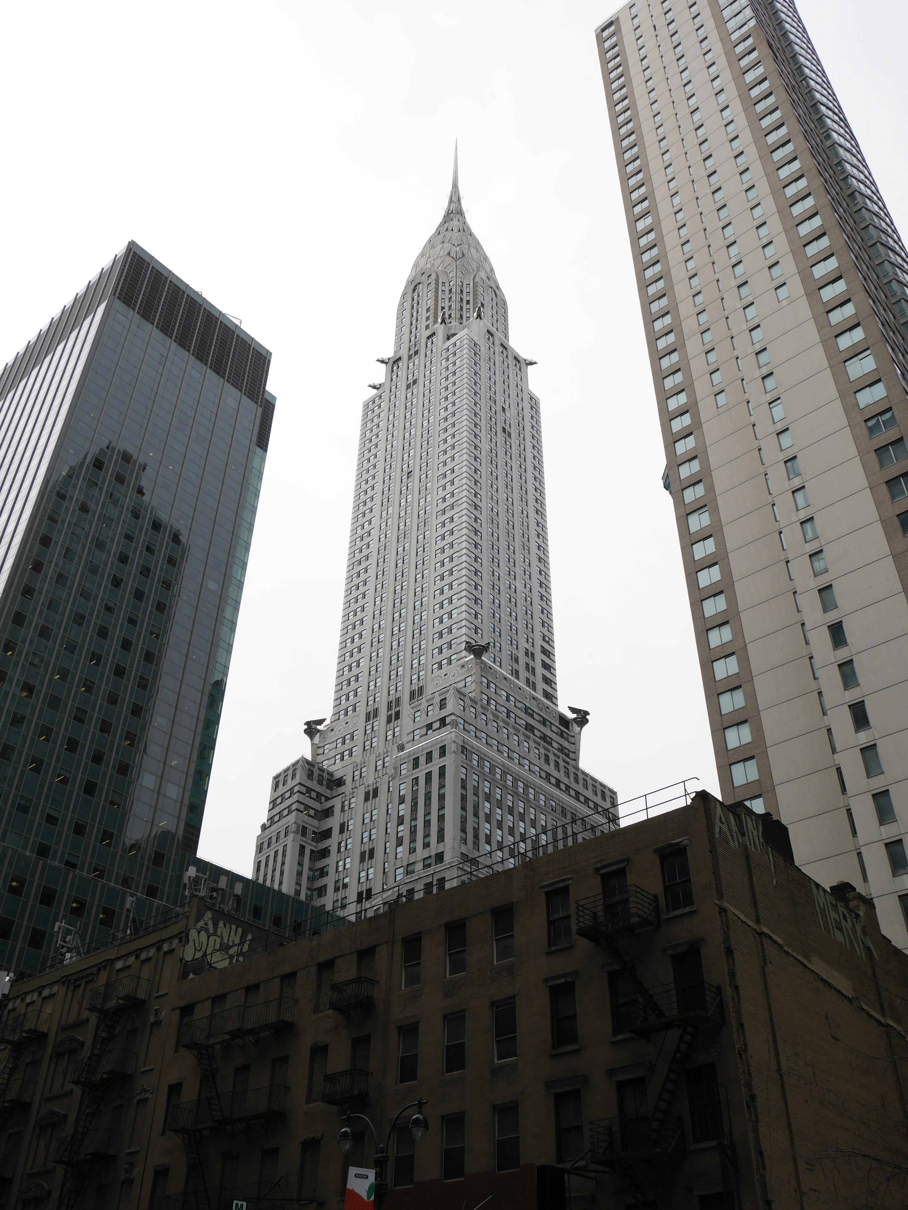 Dramatic view of the iconic Chrysler Building in New York City against the sky.