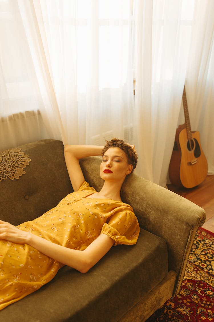 A Woman Sleeping On The Sofa 