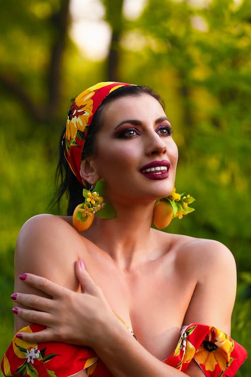 Woman with Makeup and Colorful Earrings