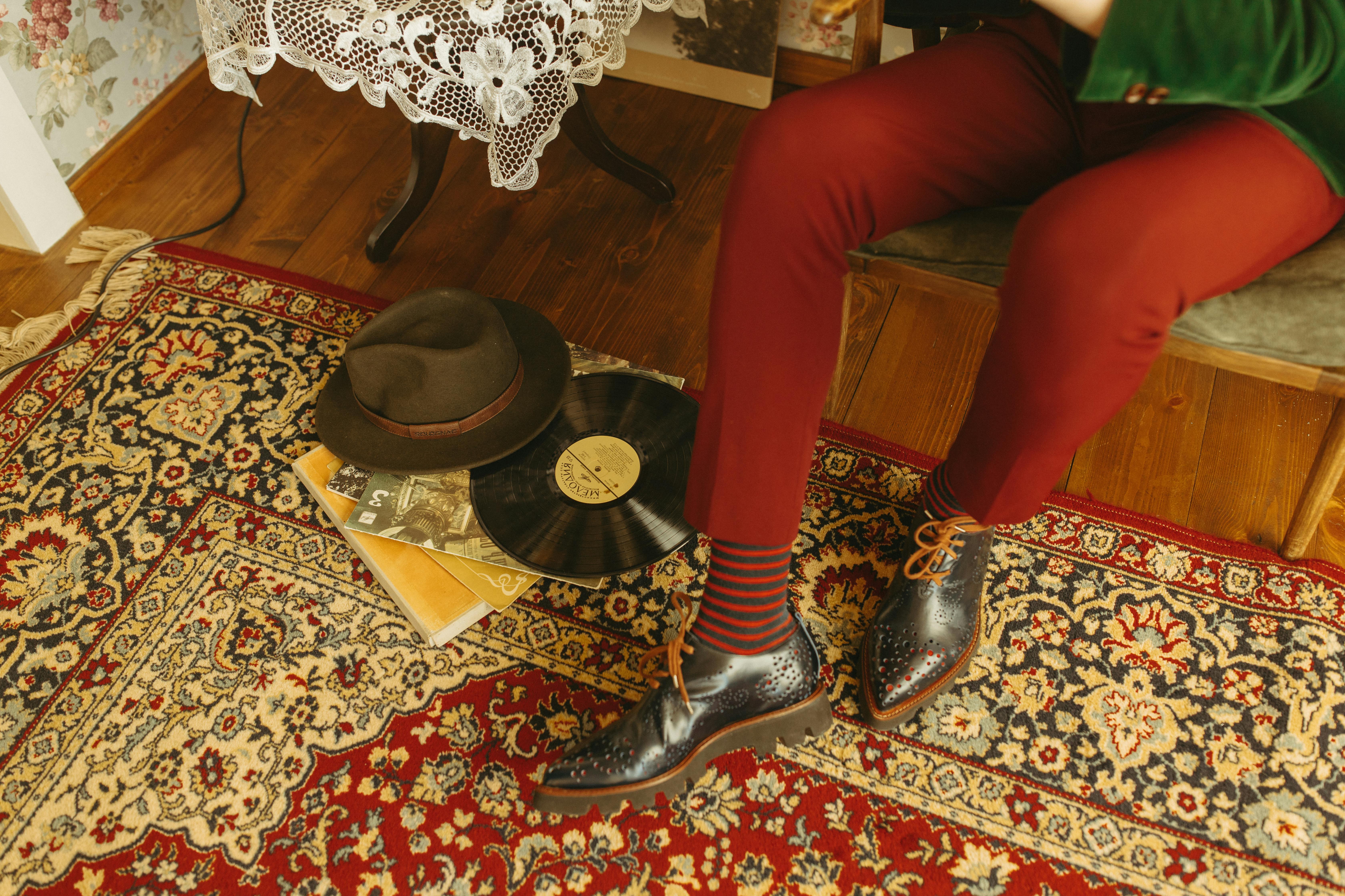 Vintage-themed room showcasing retro fashion, a vinyl record, and classic decor for a nostalgic vibe.