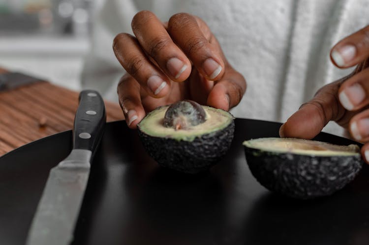 A Sliced Avocado On A Plate 