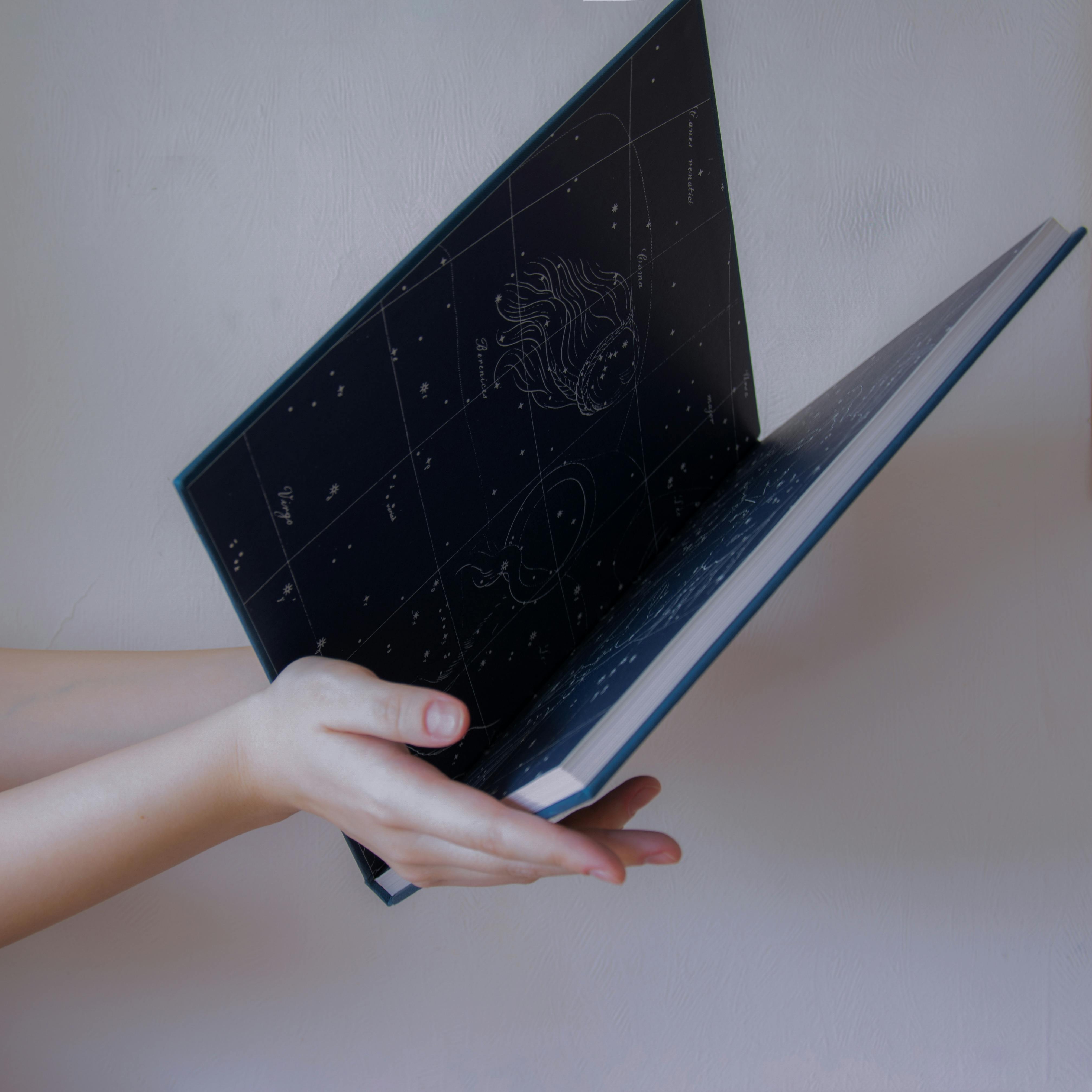 Hands Holding a Book 