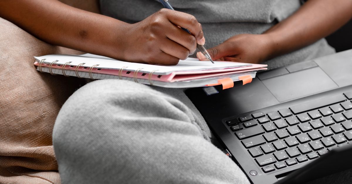 Person With Notebook A Person Writing on a Notebook · Free Stock Photo