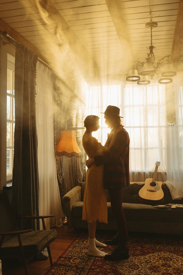 
A Couple Dancing In A Living Room