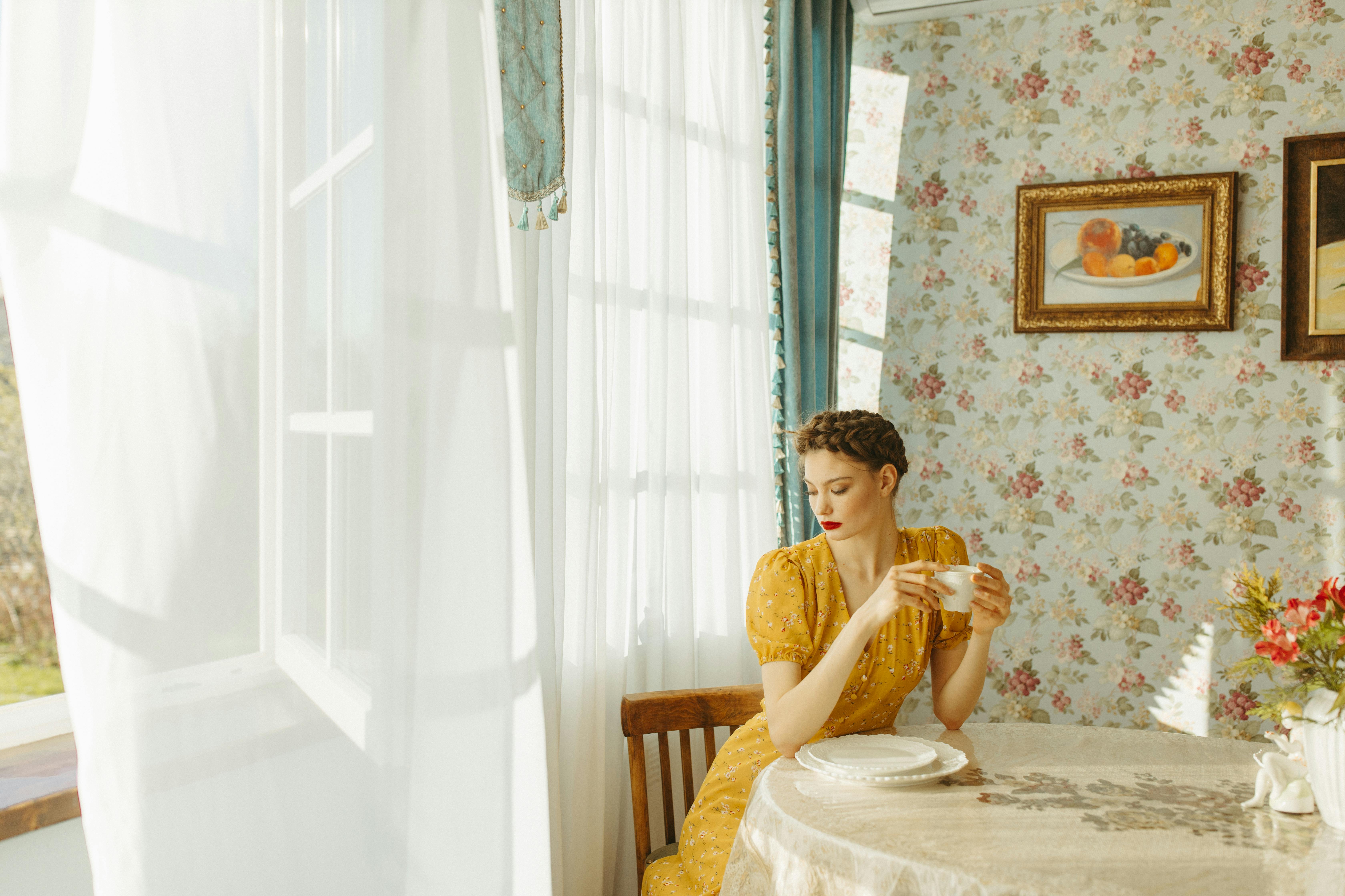 woman in yellow sweater sitting on chair
